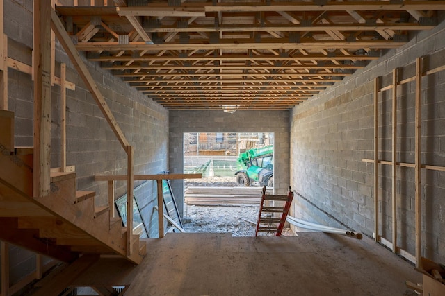miscellaneous room featuring concrete block wall