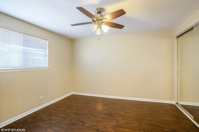 unfurnished room featuring ceiling fan, baseboards, and wood finished floors