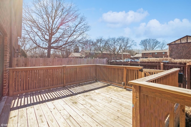 wooden terrace featuring fence