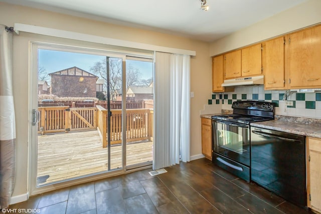 kitchen with under cabinet range hood, decorative backsplash, black appliances, and visible vents