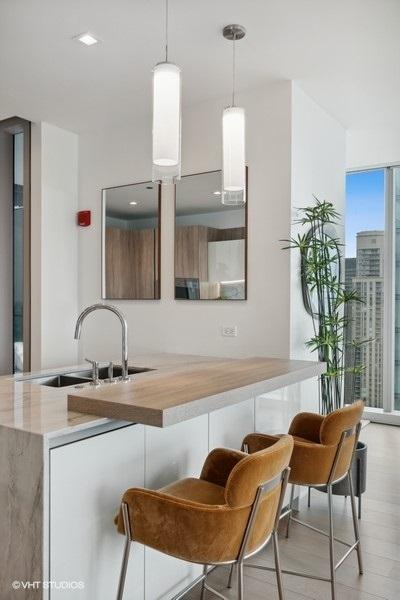 kitchen with hanging light fixtures and a sink