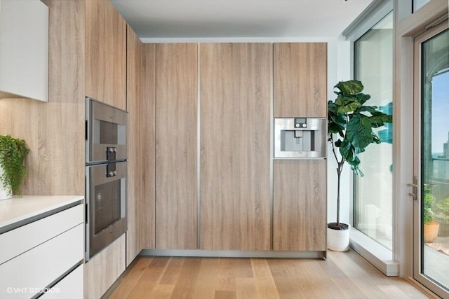 entryway with light wood finished floors