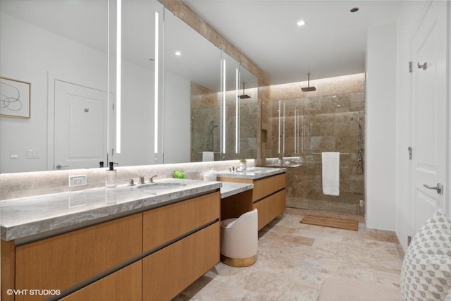 full bathroom featuring a shower stall and vanity