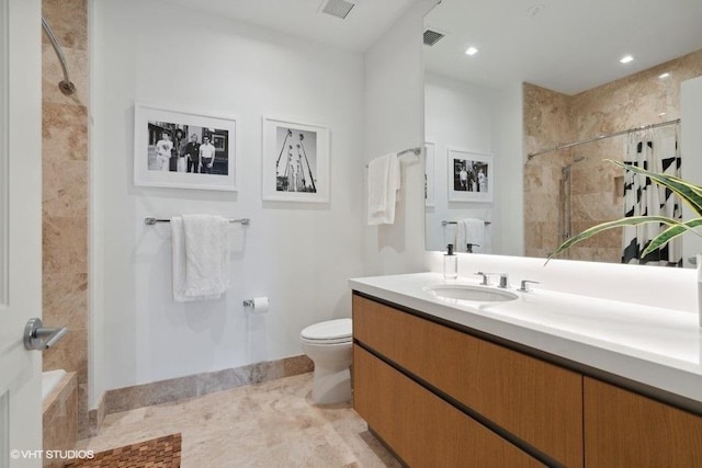 bathroom with toilet, visible vents, a tile shower, and vanity