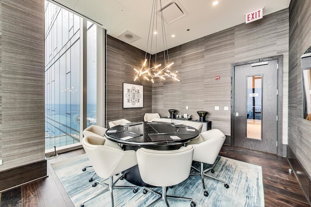 dining room featuring an inviting chandelier and wood finished floors