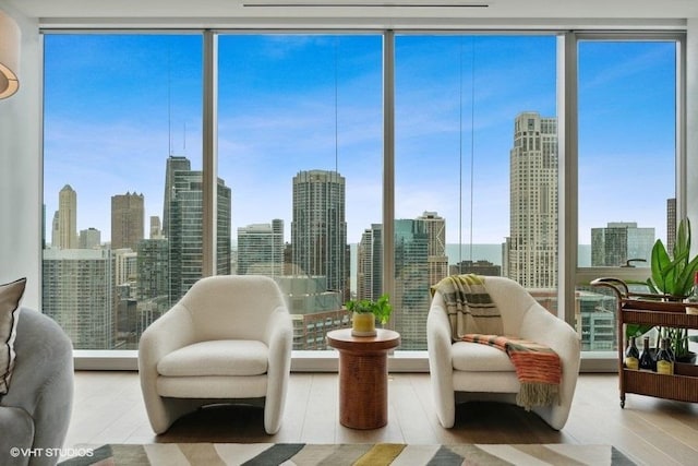 sunroom / solarium featuring a wealth of natural light and a city view