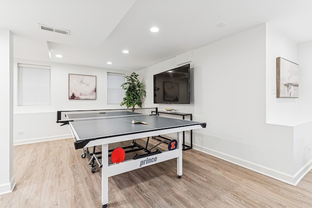 rec room featuring baseboards, visible vents, and light wood-type flooring