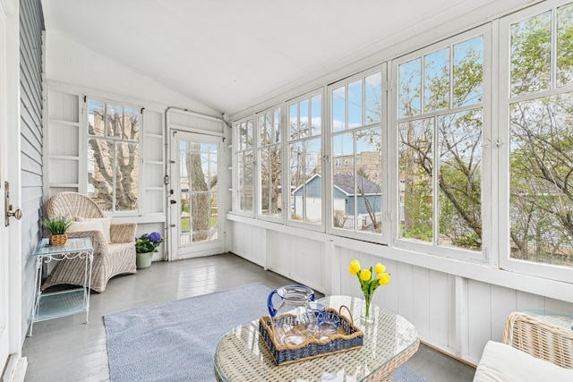 sunroom with a healthy amount of sunlight and french doors