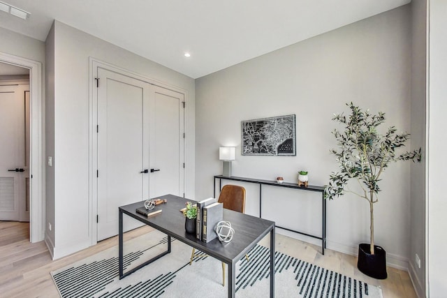 office area featuring recessed lighting, baseboards, light wood finished floors, and visible vents