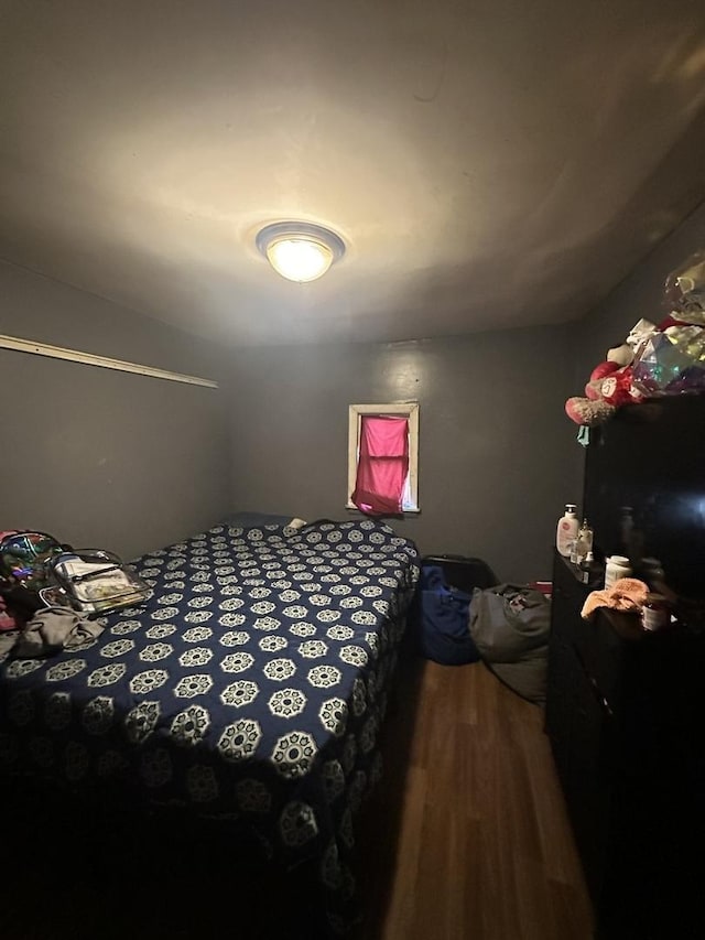 bedroom featuring wood finished floors