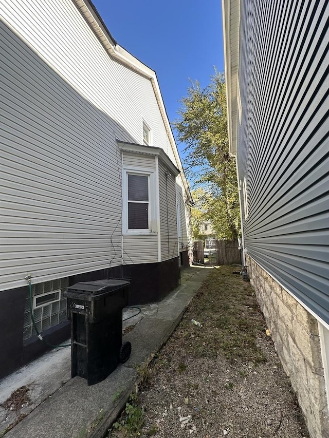 view of home's exterior with fence