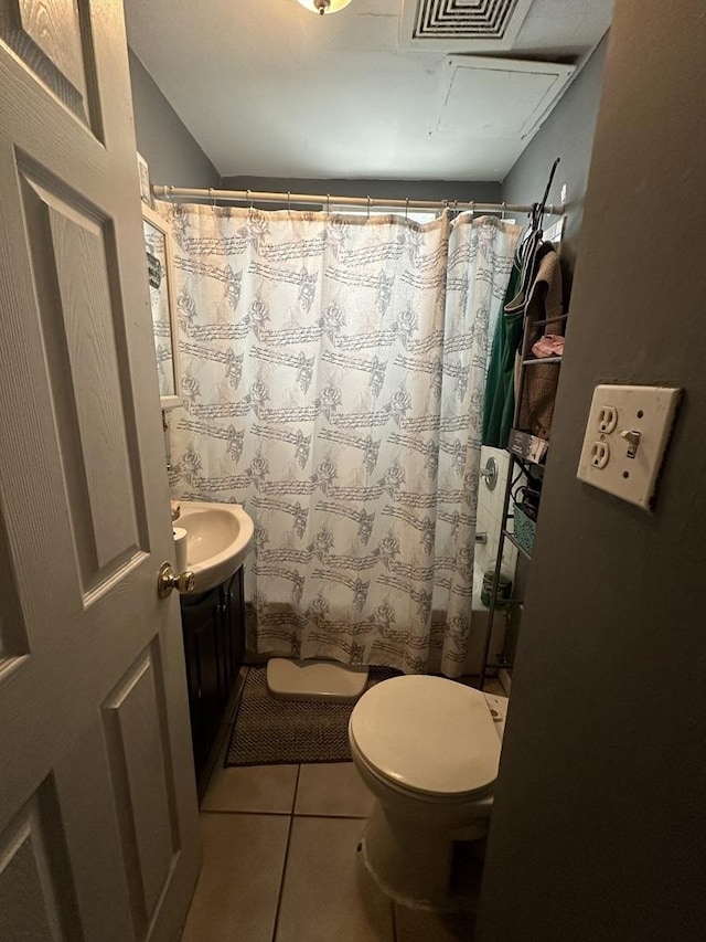 bathroom with visible vents, toilet, tile patterned floors, curtained shower, and vanity