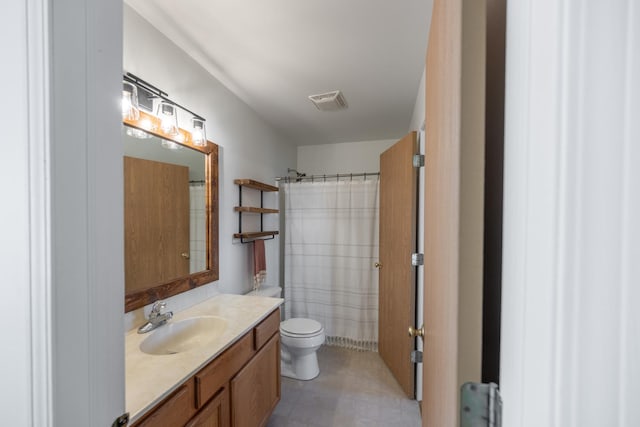 bathroom with visible vents, toilet, a shower with shower curtain, tile patterned floors, and vanity