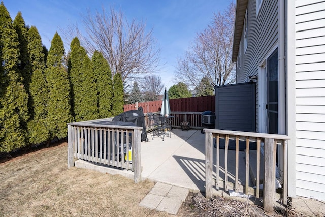 view of patio featuring fence