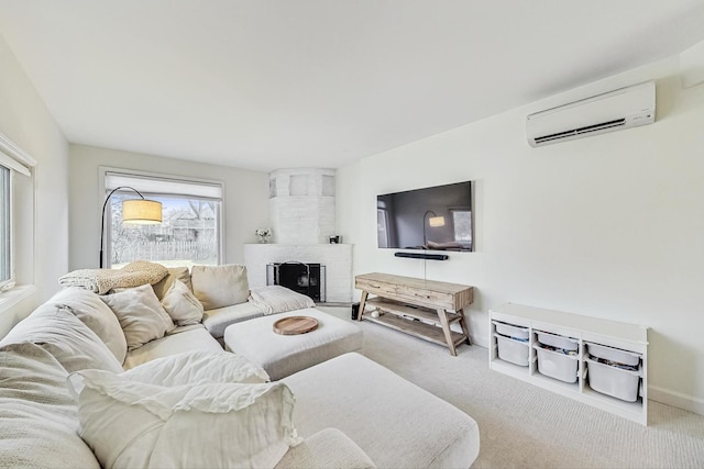 carpeted living area featuring baseboards, a fireplace, and a wall mounted AC