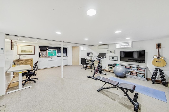 exercise area with recessed lighting and a wall unit AC