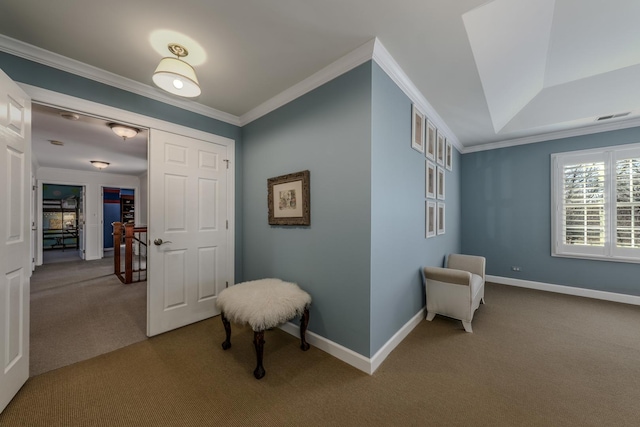 hall featuring visible vents, baseboards, carpet, and ornamental molding