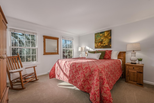 bedroom with ornamental molding, baseboards, and carpet floors