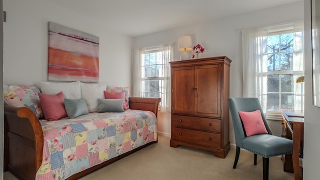 bedroom featuring light colored carpet