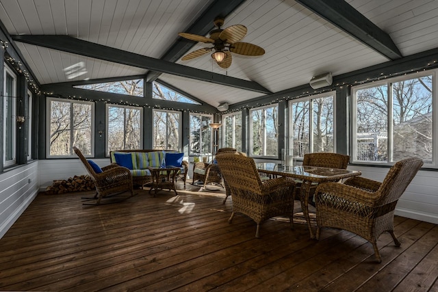 sunroom featuring vaulted ceiling with beams, a wealth of natural light, and ceiling fan