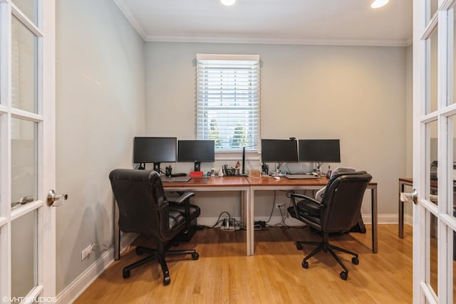 office space featuring ornamental molding, french doors, baseboards, and wood finished floors