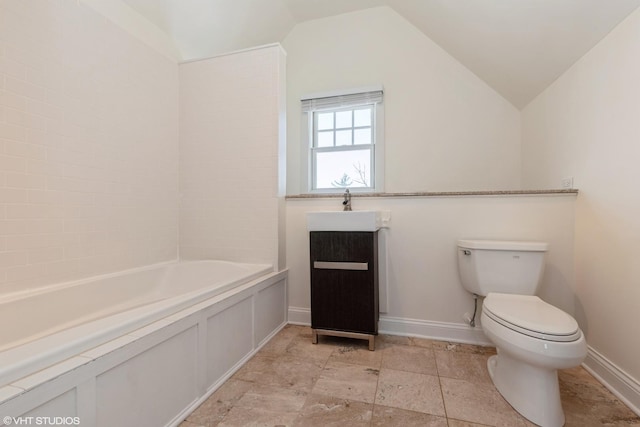 full bath featuring lofted ceiling, vanity, toilet, and baseboards