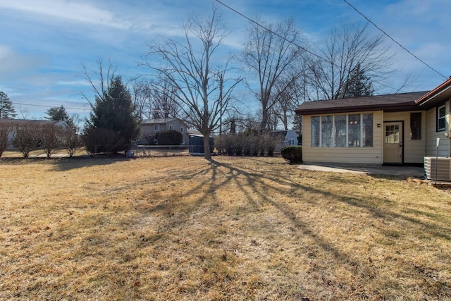 view of yard with a patio area and central AC unit