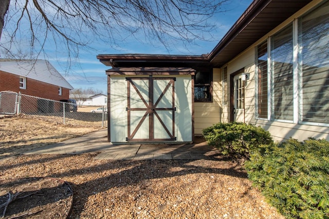 view of shed with fence