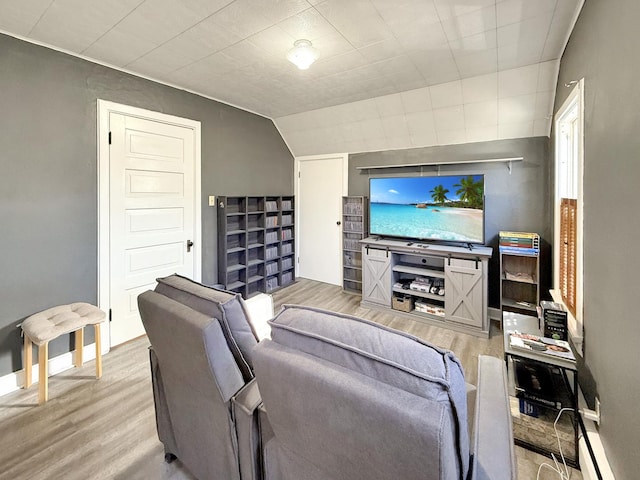 living room with light wood-type flooring and baseboards