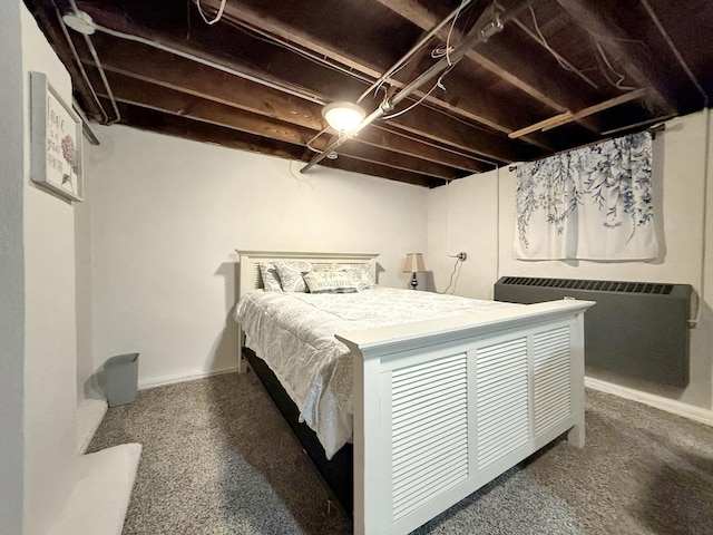 bedroom with baseboards and radiator heating unit