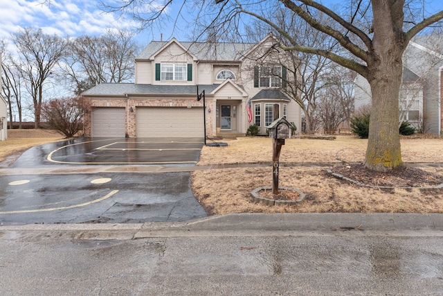 view of front of property with driveway, brick siding, roof with shingles, and an attached garage