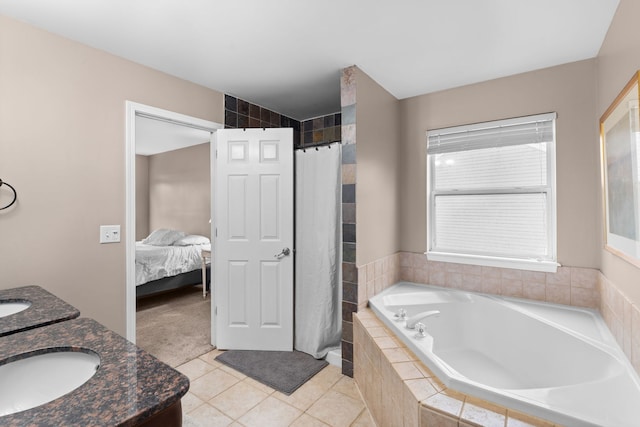 ensuite bathroom with double vanity, a shower with shower curtain, a sink, tile patterned flooring, and a bath