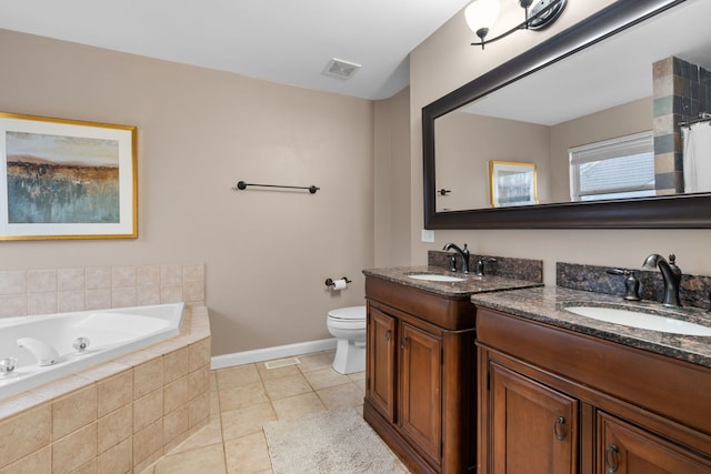 full bath with a garden tub, visible vents, toilet, vanity, and tile patterned floors