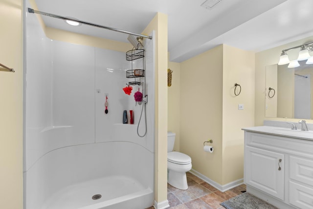 bathroom with toilet, visible vents, walk in shower, and vanity