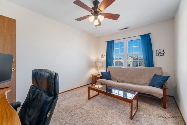 living room with a ceiling fan, carpet, visible vents, and baseboards