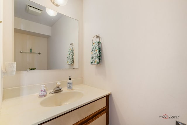 bathroom with visible vents and vanity