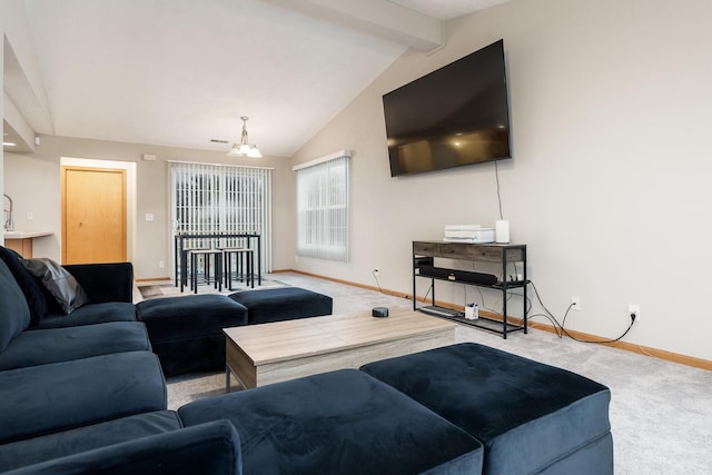 living room featuring vaulted ceiling with beams, a notable chandelier, carpet flooring, and baseboards