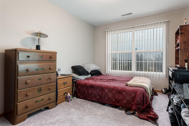 bedroom featuring visible vents and carpet flooring