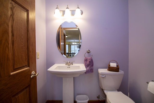 bathroom with toilet and a sink