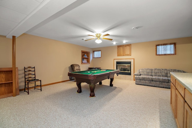 playroom featuring light carpet, a fireplace, baseboards, and pool table