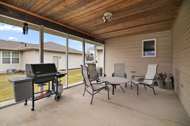 sunroom featuring wood ceiling