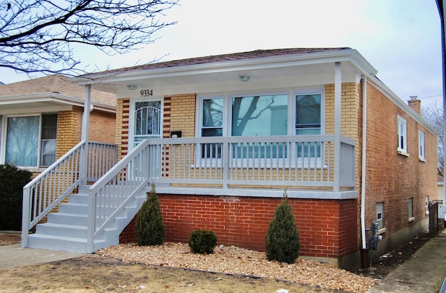 view of front of home with brick siding