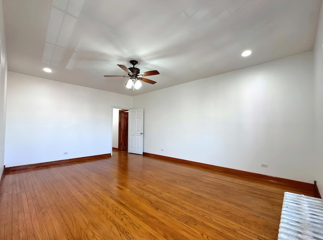 spare room featuring ceiling fan, baseboards, wood finished floors, and recessed lighting