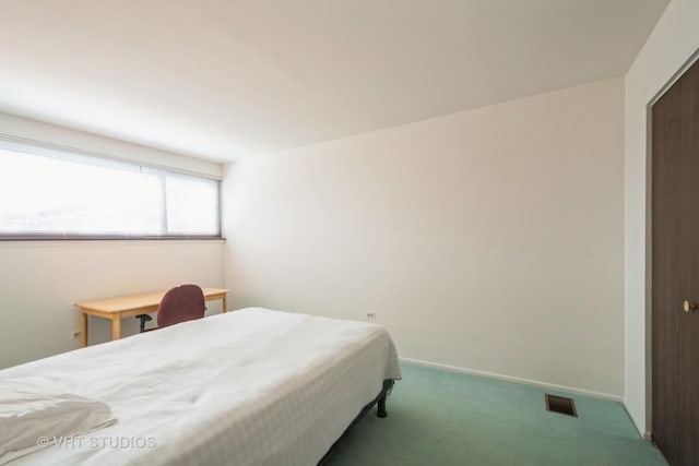 carpeted bedroom featuring baseboards and visible vents