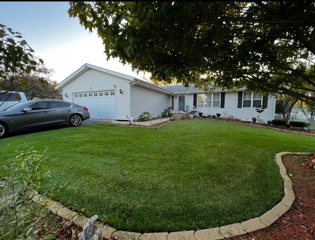 single story home featuring an attached garage and a front yard