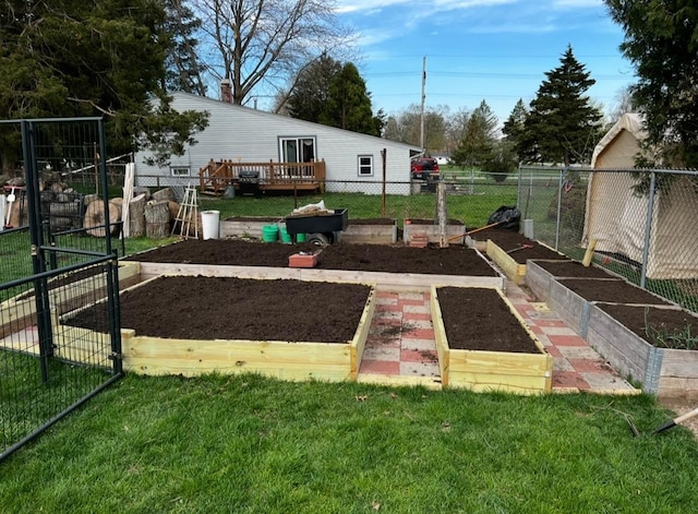 view of yard featuring a vegetable garden and fence