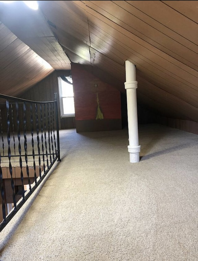 bonus room featuring wood walls, wood ceiling, and vaulted ceiling