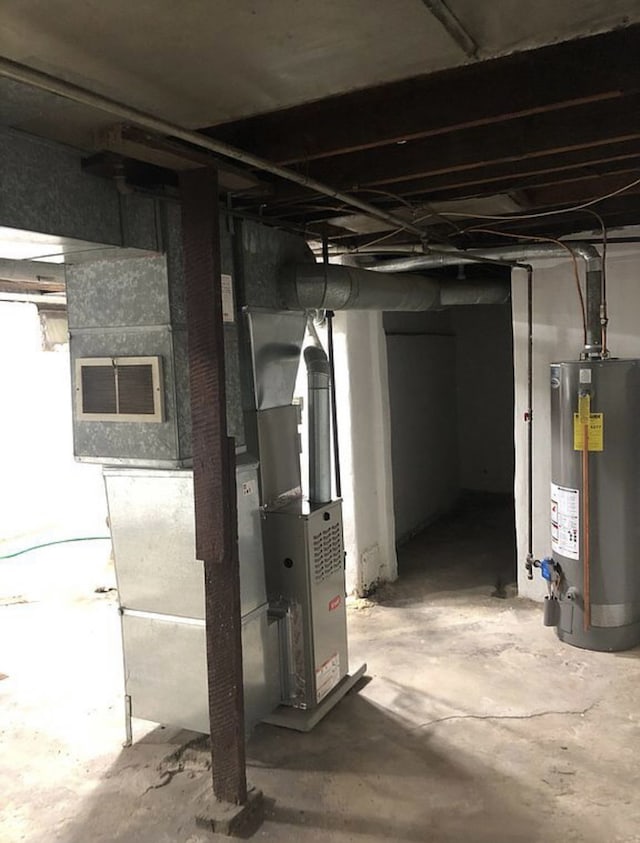 unfinished below grade area featuring gas water heater