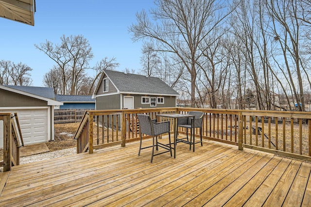 deck with an outdoor structure and fence