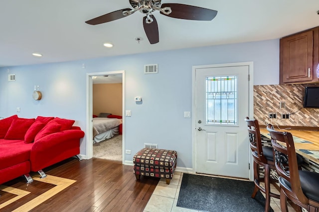 interior space with recessed lighting, visible vents, baseboards, and wood finished floors